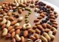 Nutritional Comparison of Peanuts, Almonds, Cashews, Pistachios, and Raisins: Calories, Protein, Fats, Carbs, Fiber, and Micronutrients 11 Nutritional Comparison of Peanuts, Almonds, Cashews, Pistachios, and Raisins: Calories, Protein, Fats, Carbs, Fiber, and Micronutrients